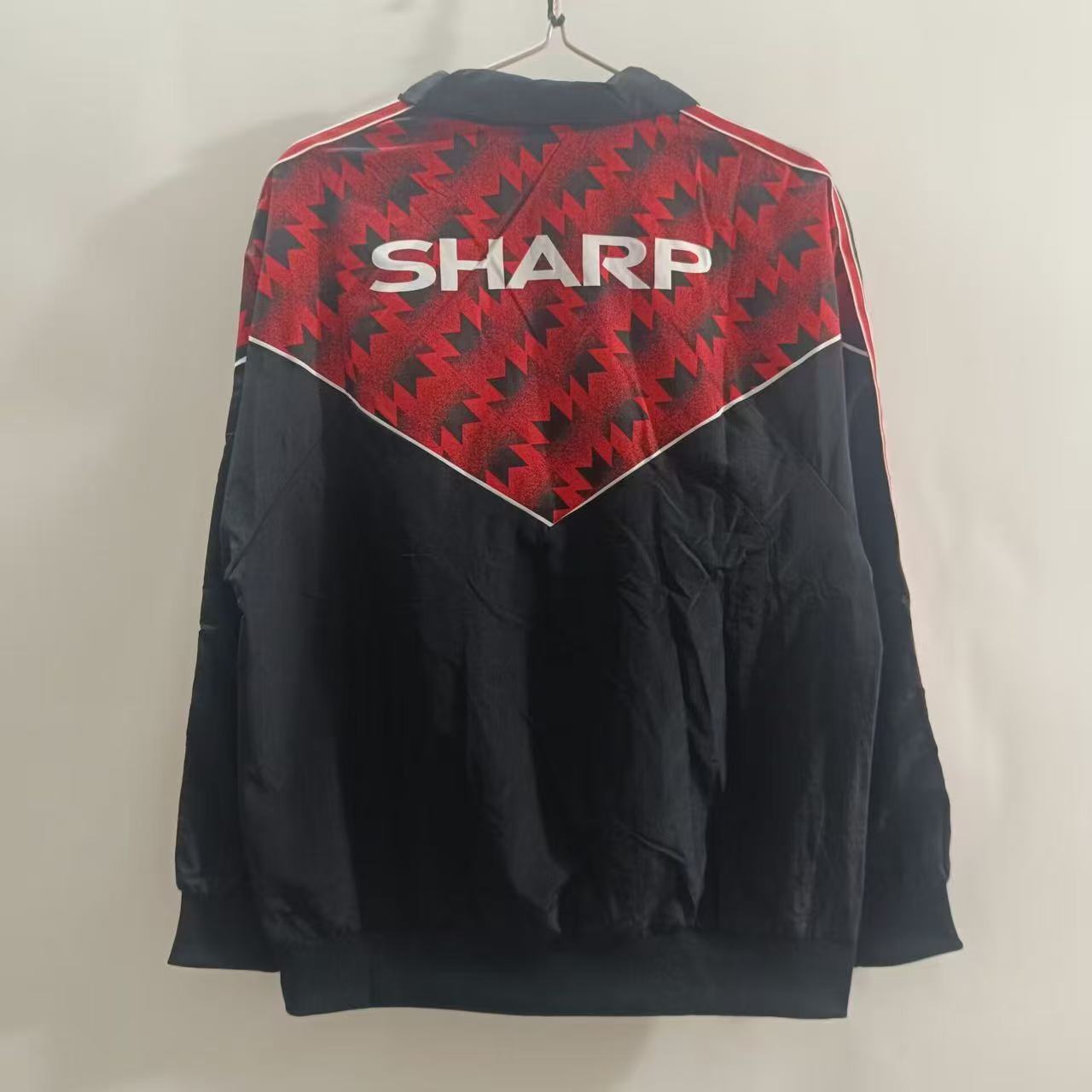 25/26 Manchester United Black with Red Zigzag Pattern Windbreaker