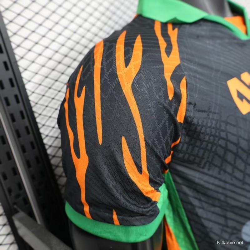 Player Version 2025 Ivory Coast Black with Elephant Graphic and Orange Stripes Jersey